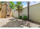 Private backyard featuring a stone fireplace, a fountain, palm trees, string lights, and a paved patio at 620 Stickley Oak Way, Woodstock, GA 30189