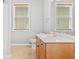 Bathroom featuring a vanity with two windows above, a toilet and a bathtub at 620 Stickley Oak Way, Woodstock, GA 30189