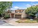 Charming home exterior with a brick driveway and manicured landscaping at 620 Stickley Oak Way, Woodstock, GA 30189