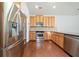 This kitchen boasts stainless steel appliances, granite countertops, and ample cabinet space at 620 Stickley Oak Way, Woodstock, GA 30189