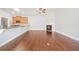 Living area with hardwood floors, fireplace, and bar seating at the kitchen at 620 Stickley Oak Way, Woodstock, GA 30189