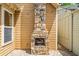 Cozy outdoor fireplace on a paved patio with string lights for evening relaxation at 620 Stickley Oak Way, Woodstock, GA 30189
