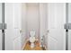 Small powder room featuring a toilet and sink, conveniently located at 620 Stickley Oak Way, Woodstock, GA 30189