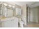 Bathroom featuring granite counters, decorative lighting, a vanity and marble shower at 700 Park Regency Ne Pl # 1203, Atlanta, GA 30326
