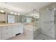 Luxurious bathroom with double sinks, a soaking tub, and a separate walk-in shower with glass door at 700 Park Regency Ne Pl # 1203, Atlanta, GA 30326
