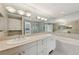 Luxurious bathroom featuring double sinks, a soaking tub, and a walk-in shower at 700 Park Regency Ne Pl # 1203, Atlanta, GA 30326