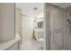Bathroom featuring granite countertop vanity, marble shower stall, and linen closet at 700 Park Regency Ne Pl # 1203, Atlanta, GA 30326