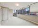 Serene bedroom with cityscape views through large windows, plush carpeting, and ample natural light at 700 Park Regency Ne Pl # 1203, Atlanta, GA 30326