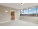 Spacious bedroom with an en-suite bathroom featuring a tub, glass enclosed shower, and large windows at 700 Park Regency Ne Pl # 1203, Atlanta, GA 30326