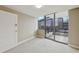 Neutral bedroom boasts modern aesthetic with floor to ceiling glass doors out to the balcony at 700 Park Regency Ne Pl # 1203, Atlanta, GA 30326