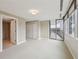 Cozy bedroom featuring balcony access, lots of natural light, and ample closet space at 700 Park Regency Ne Pl # 1203, Atlanta, GA 30326