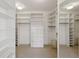 Organized walk-in closet with custom shelving, drawers, and ample hanging space at 700 Park Regency Ne Pl # 1203, Atlanta, GA 30326