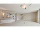 Bright, open-concept living space with modern lighting, neutral walls, and a seamless flow to the kitchen at 700 Park Regency Ne Pl # 1203, Atlanta, GA 30326