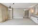 Bright living area featuring neutral tones, modern lighting fixtures, and an open layout for easy living at 700 Park Regency Ne Pl # 1203, Atlanta, GA 30326