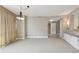 Spacious living area featuring neutral tones, modern lighting fixtures, and an open layout for easy living at 700 Park Regency Ne Pl # 1203, Atlanta, GA 30326