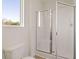 Modern bathroom featuring a glass-enclosed shower and updated fixtures at 8594 Secretariat Dr, Lithonia, GA 30058