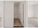 View into a bathroom with a tile floor and a white shower/tub combo at 8594 Secretariat Dr, Lithonia, GA 30058