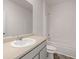 Cozy bathroom features a vanity with sink, a mirror, a toilet, and a shower tub at 8594 Secretariat Dr, Lithonia, GA 30058