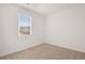 Bright bedroom with natural light from a large window and neutral carpeting at 8594 Secretariat Dr, Lithonia, GA 30058