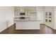 Modern kitchen featuring gray cabinets, stainless steel appliances, granite countertops, and dark wood floors at 8594 Secretariat Dr, Lithonia, GA 30058