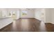 Spacious living room features gleaming hardwood floors and plenty of natural light at 8594 Secretariat Dr, Lithonia, GA 30058