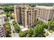Stunning aerial view of the luxury high-rise apartment building surrounded by lush greenery at 3286 Northside Nw Pkwy # 903, Atlanta, GA 30327