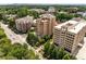 Scenic aerial view of a high-rise apartment building surrounded by tree-lined streets at 3286 Northside Nw Pkwy # 903, Atlanta, GA 30327