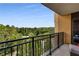 Relaxing outdoor balcony with black metal railing provides natural light with a beautiful lush green tree view at 3286 Northside Nw Pkwy # 903, Atlanta, GA 30327
