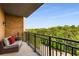 Relaxing outdoor balcony with black metal railing provides natural light with a beautiful lush green tree view at 3286 Northside Nw Pkwy # 903, Atlanta, GA 30327