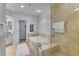 Modern bathroom featuring a glass-enclosed shower and a luxurious soaking tub at 3286 Northside Nw Pkwy # 903, Atlanta, GA 30327