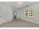 Carpeted bedroom featuring natural light from windows and a private balcony entrance at 3286 Northside Nw Pkwy # 903, Atlanta, GA 30327