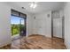 A bright bedroom with hardwood floors and balcony access with serene natural views at 3286 Northside Nw Pkwy # 903, Atlanta, GA 30327