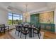 Bright dining room featuring a chandelier, hardwood floors, and views of trees at 3286 Northside Nw Pkwy # 903, Atlanta, GA 30327