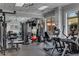 Well-equipped gym with modern fitness equipment, mirrored wall, and natural light at 3286 Northside Nw Pkwy # 903, Atlanta, GA 30327
