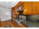 Gourmet kitchen with granite counters and stainless steel gas range at 3286 Northside Nw Pkwy # 903, Atlanta, GA 30327