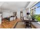 Spacious living room features hardwood floors, high ceilings, large windows, and stylish furniture at 3286 Northside Nw Pkwy # 903, Atlanta, GA 30327
