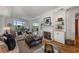 Cozy living room featuring a fireplace, built-in shelves, and large windows with beautiful views at 3286 Northside Nw Pkwy # 903, Atlanta, GA 30327
