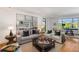 Inviting living room with stylish decor, hardwood floors, and serene views from large windows at 3286 Northside Nw Pkwy # 903, Atlanta, GA 30327