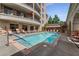 Beautiful outdoor pool area with lounge chairs, surrounded by lush landscaping and elegant architecture at 3286 Northside Nw Pkwy # 903, Atlanta, GA 30327