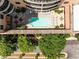 Aerial view of community pool, lounge chairs, tables and manicured landscaping at 3286 Northside Nw Pkwy # 903, Atlanta, GA 30327
