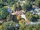 Sprawling property showcasing lush greenery, mature trees, and an inviting home with a long driveway at 427 Picketts Lake Dr, Acworth, GA 30101