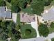 Aerial view of a charming home featuring lush greenery, mature trees and beautiful landscaping in quiet neighborhood at 427 Picketts Lake Dr, Acworth, GA 30101