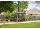 Charming backyard with a gazebo, mature trees and a well-kept lawn at 427 Picketts Lake Dr, Acworth, GA 30101