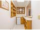 Home bar featuring a mini-fridge, sink and storage shelves at 427 Picketts Lake Dr, Acworth, GA 30101