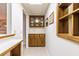 Home bar featuring upper and lower wood cabinets at 427 Picketts Lake Dr, Acworth, GA 30101