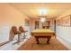 Basement with a pool table and chairs at 427 Picketts Lake Dr, Acworth, GA 30101