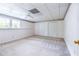 Bedroom featuring plush neutral carpet, ceiling fan, and double closets at 427 Picketts Lake Dr, Acworth, GA 30101