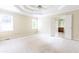 Spacious bedroom with trey ceiling, plush carpet, and French doors to the bathroom at 427 Picketts Lake Dr, Acworth, GA 30101