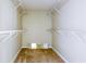 Walk-in closet featuring carpeted floors and ample shelving at 427 Picketts Lake Dr, Acworth, GA 30101