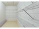 Walk-in closet with white wire shelving and neutral flooring at 427 Picketts Lake Dr, Acworth, GA 30101